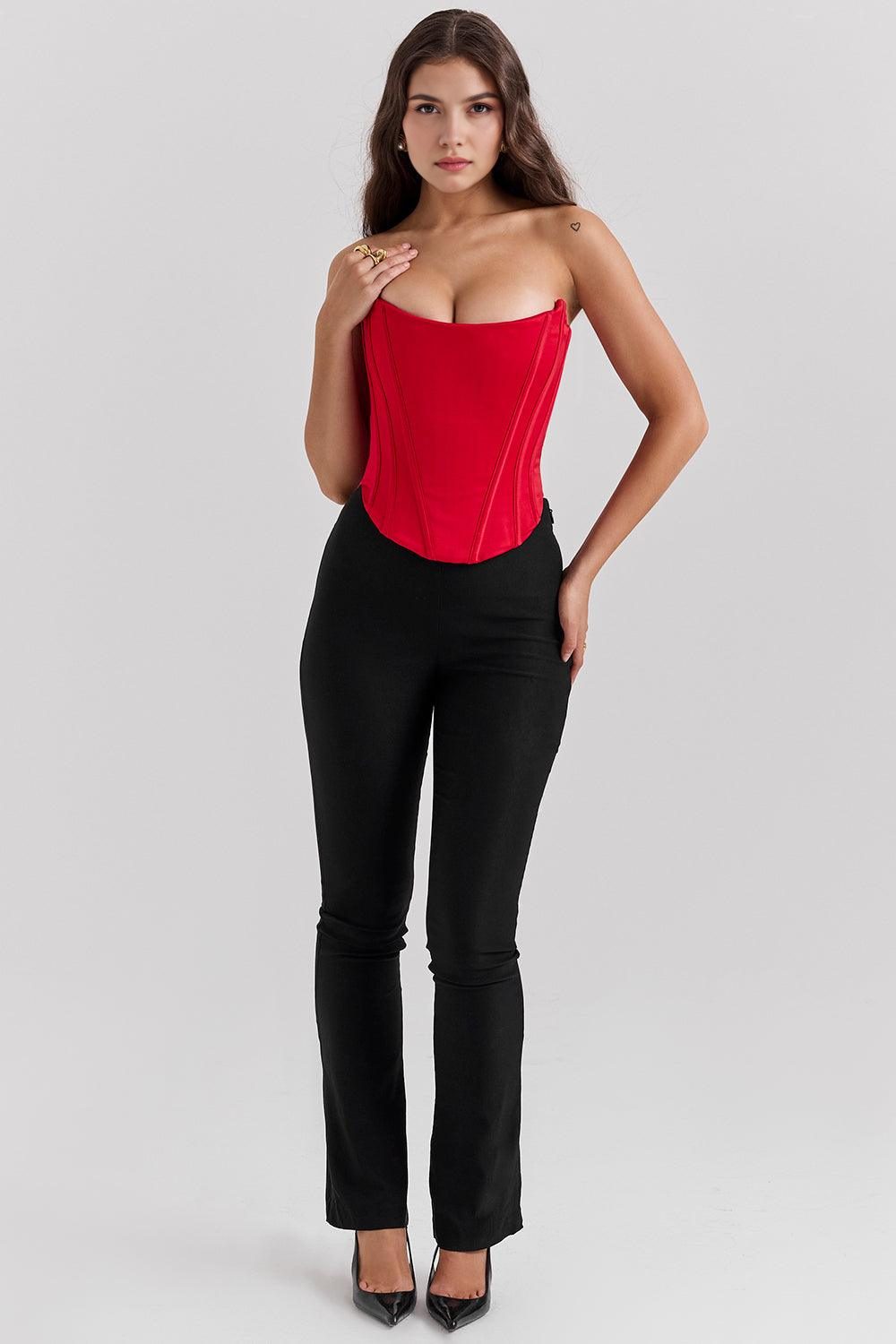 Imagem do Corset Modelador Bellini, com barbatanas verticais, modelagem ajustada e caimento elegante. A peça realça a silhueta com sofisticação, perfeita para compor looks modernos com calças ou saias de cintura alta.