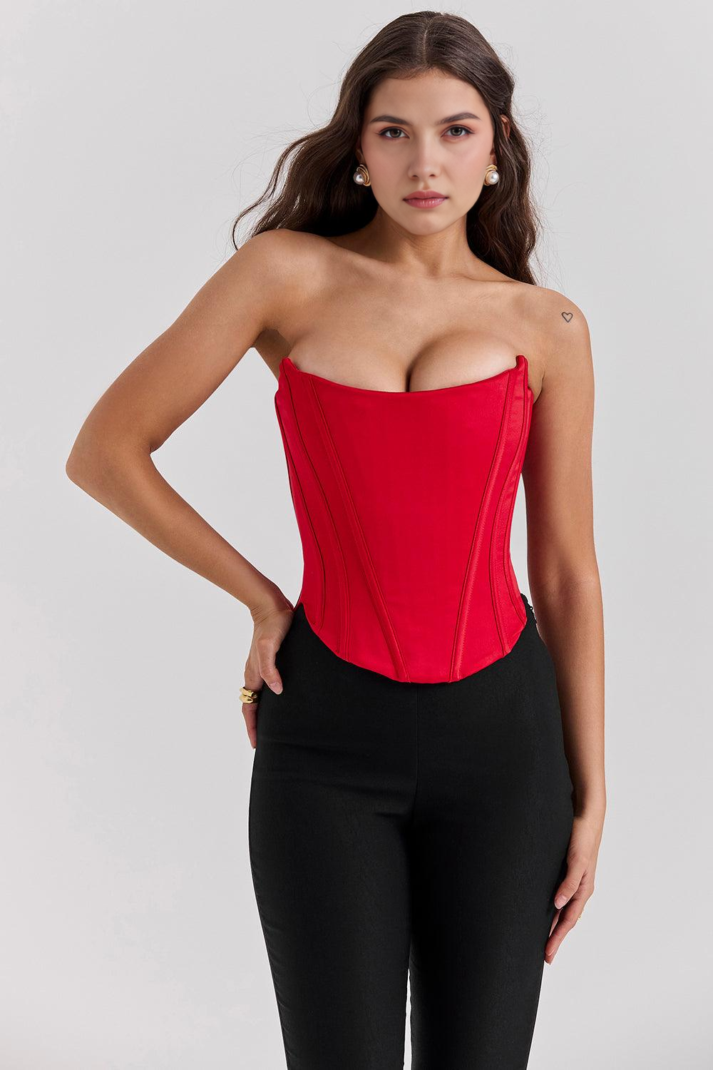 Imagem do Corset Modelador Bellini, com barbatanas verticais, modelagem ajustada e caimento elegante. A peça realça a silhueta com sofisticação, perfeita para compor looks modernos com calças ou saias de cintura alta.