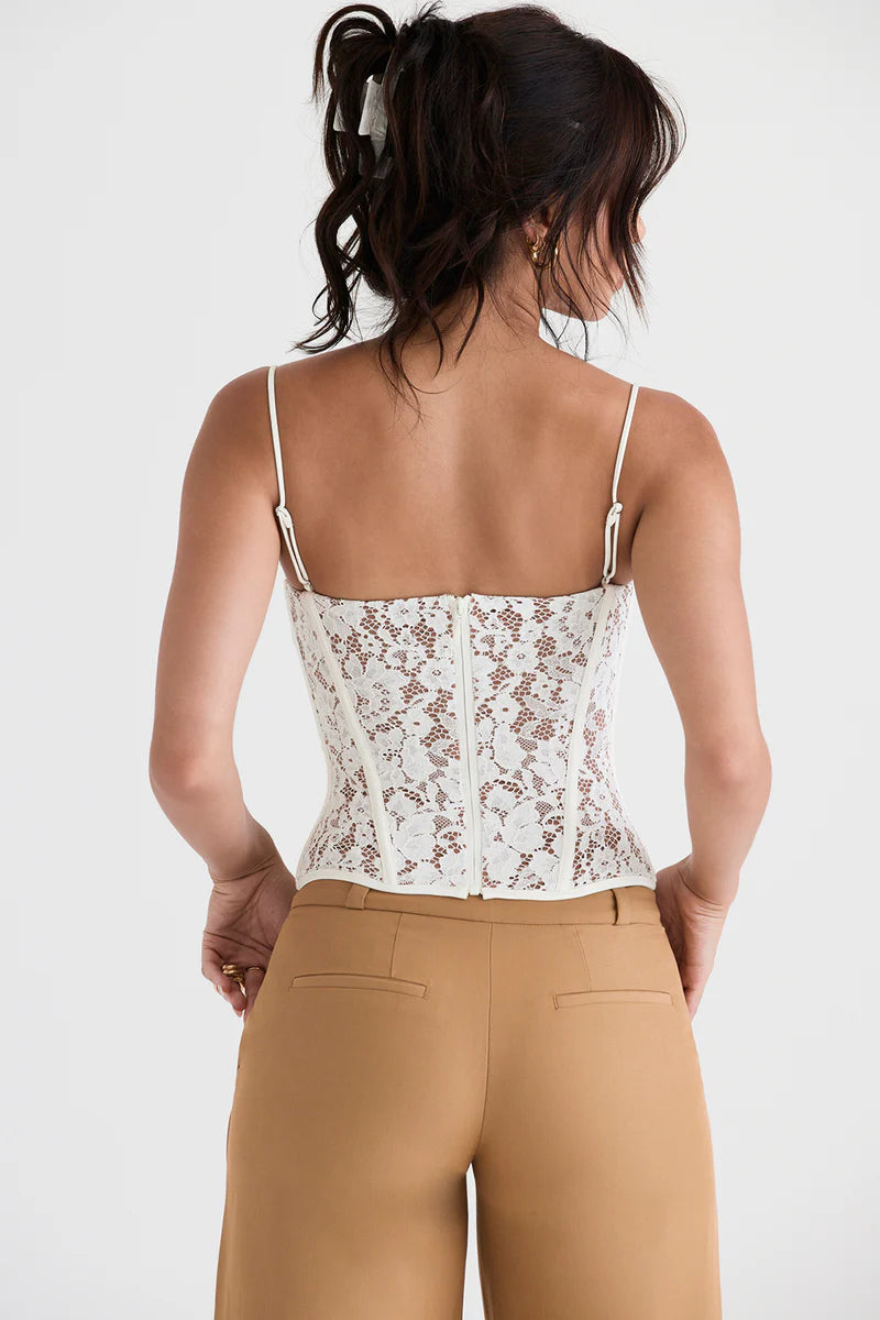 Corset Renda Frangelico em tecido com decote suave, estrutura estilo clássico e caimento cropped. Ideal para festas e baladas. Disponível do P ao G. Destaque sensual para compor looks sofisticados e modernos.