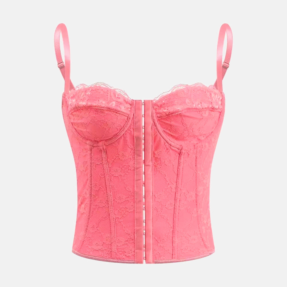 Corset Pink Lady com design clássico em renda, decote suave com suporte no busto, estrutura marcada e caimento cropped. Realça a cintura com elegância. Ideal para festas, baladas e jantares sofisticados.